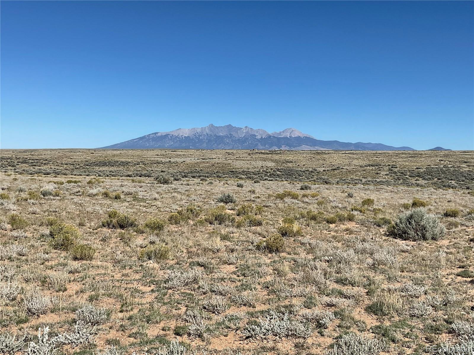 a view of an ocean beach and mountain