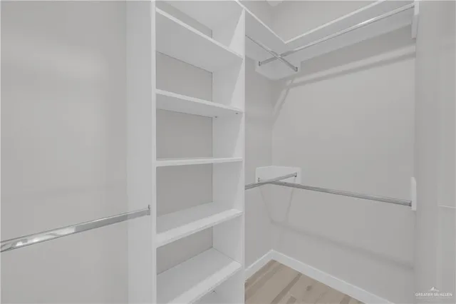 a view of an empty walk in closet