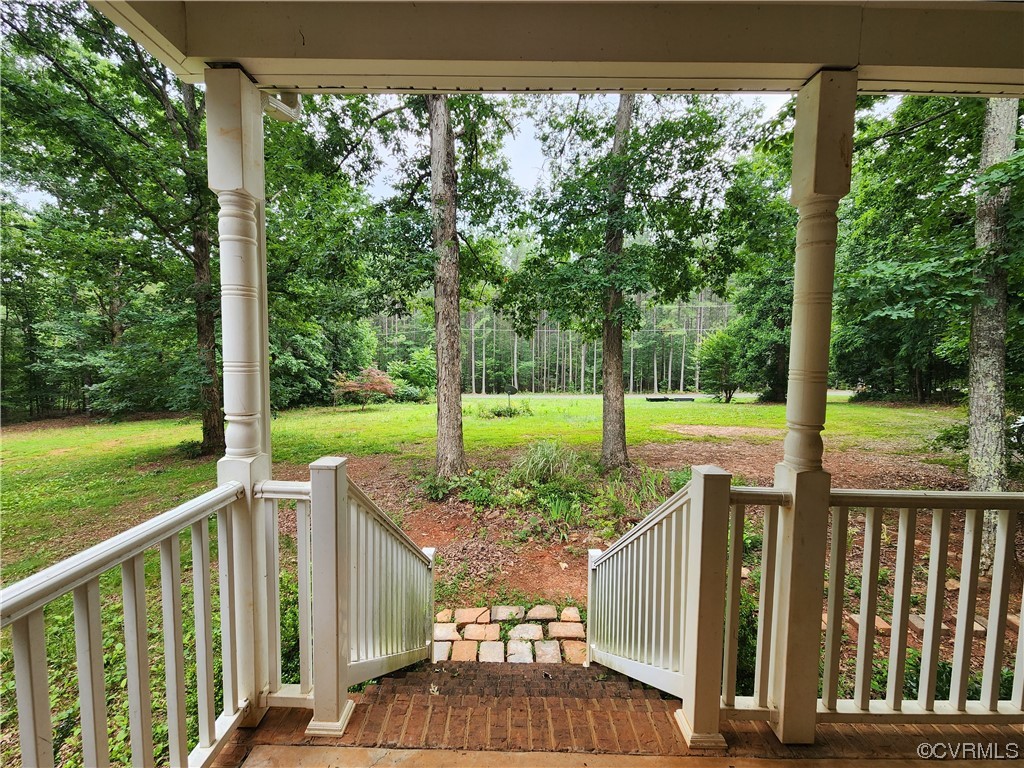 5920 Community House Road Columbia, VA 23038 - Photo 16 of 19 a view of backyard with green space and porch
