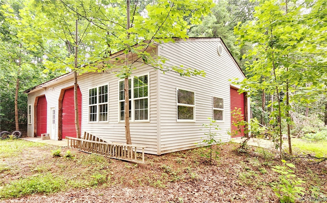 5920 Community House Road Columbia, VA 23038 - Photo 17 of 19 a view of a house with a yard