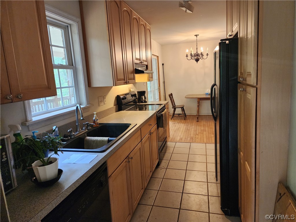 5920 Community House Road Columbia, VA 23038 - Photo 4 of 19 a kitchen with a sink and refrigerator