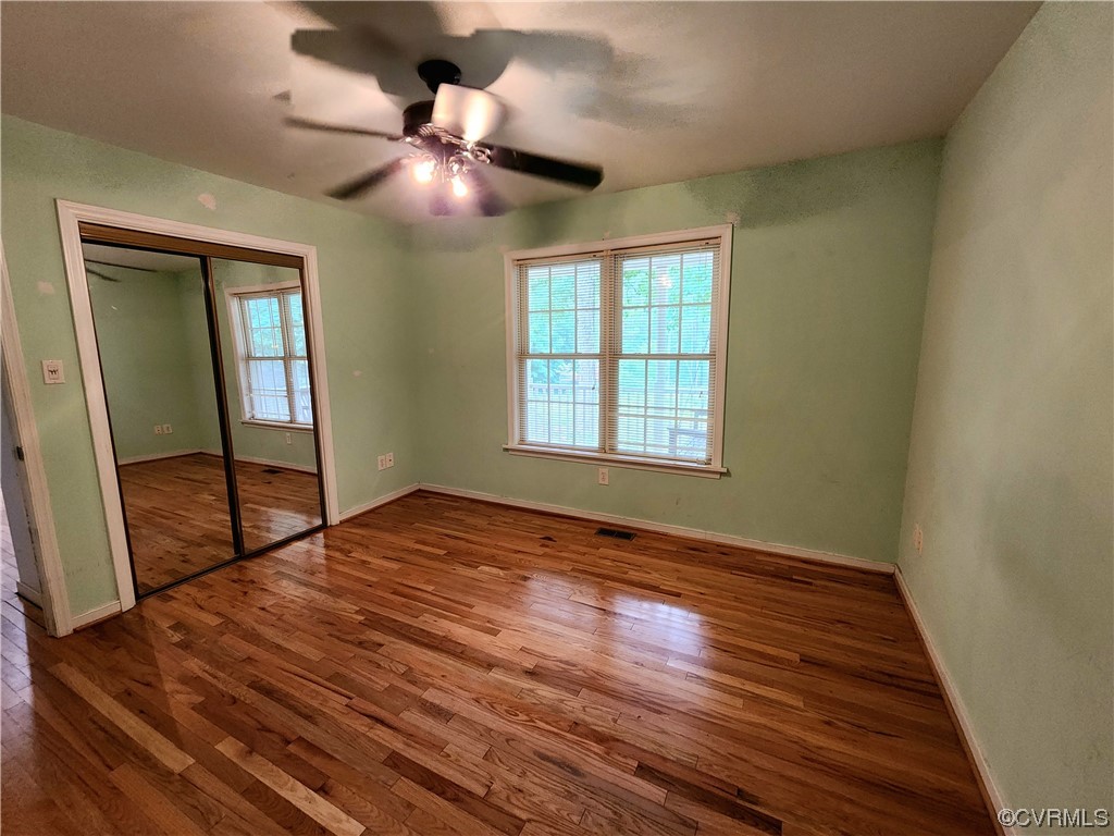 5920 Community House Road Columbia, VA 23038 - Photo 6 of 19 a view of an empty room with wooden floor and a window