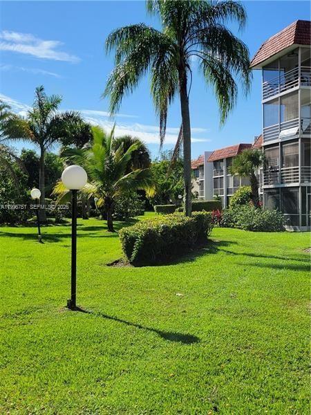 3774 Inverrary Boulevard, Unit 206P Lauderhill, FL 33319 - Photo 13 of 17 a view of a park with a palm trees