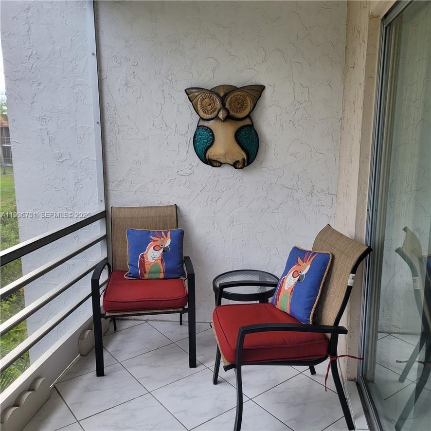 3774 Inverrary Boulevard, Unit 206P Lauderhill, FL 33319 - Photo 14 of 17 a view of workspace with lounge chair and couch