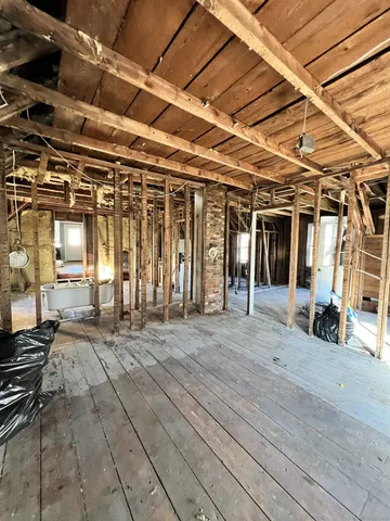 a view of a hall with wooden floor