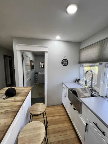 a kitchen with stainless steel appliances granite countertop a sink and cabinets