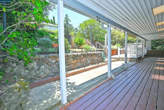 a view of a backyard and trees