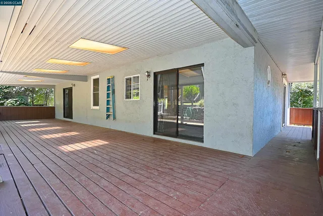 a view of a two chairs in the balcony