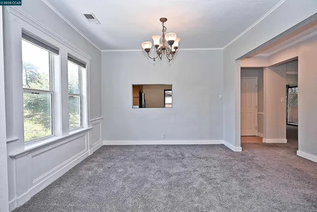 a view of a room that has a bed and a window