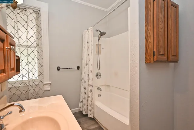 a white toilet sitting next to a bathroom sink