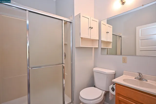 an empty room with sliding glass door and glass door