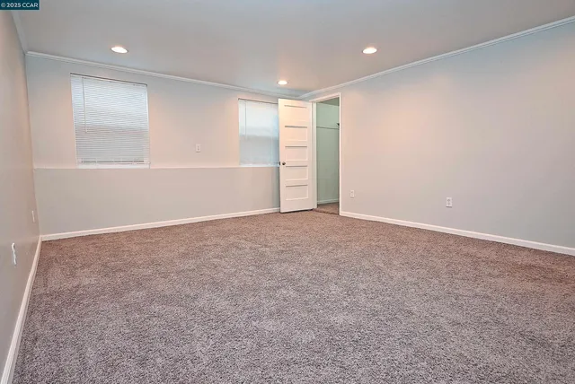 an aerial view of a house with swimming pool and garden