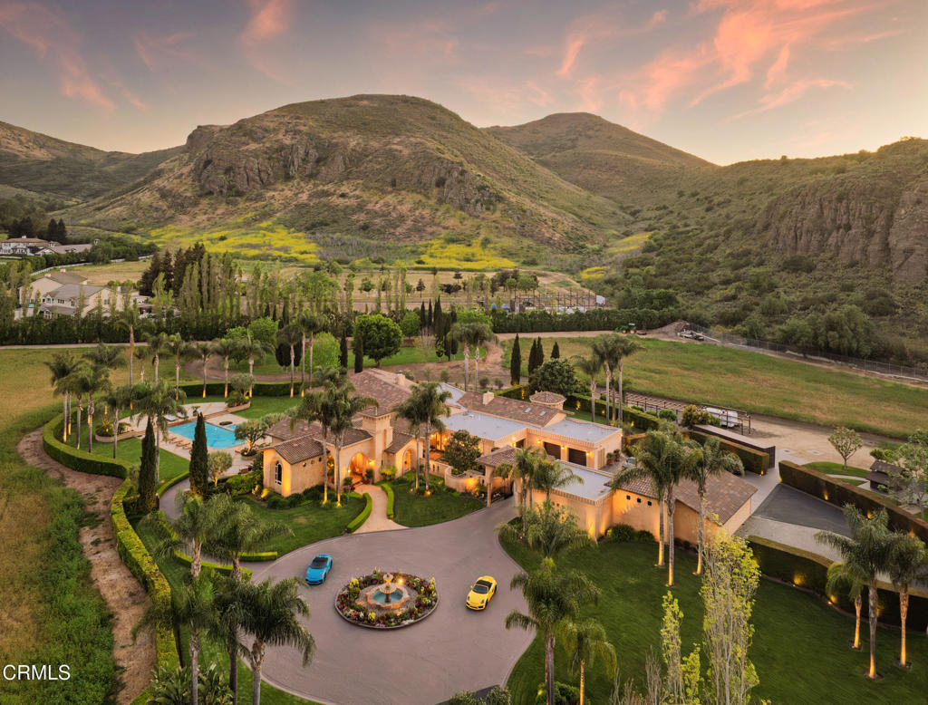 a view of a terrace with a table and chairs