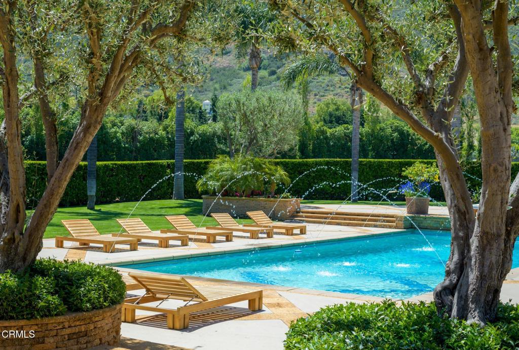 11113 Rocky High Road Camarillo, CA 93012 - Photo 11 of 48 a view of a swimming pool with a patio and fire pit