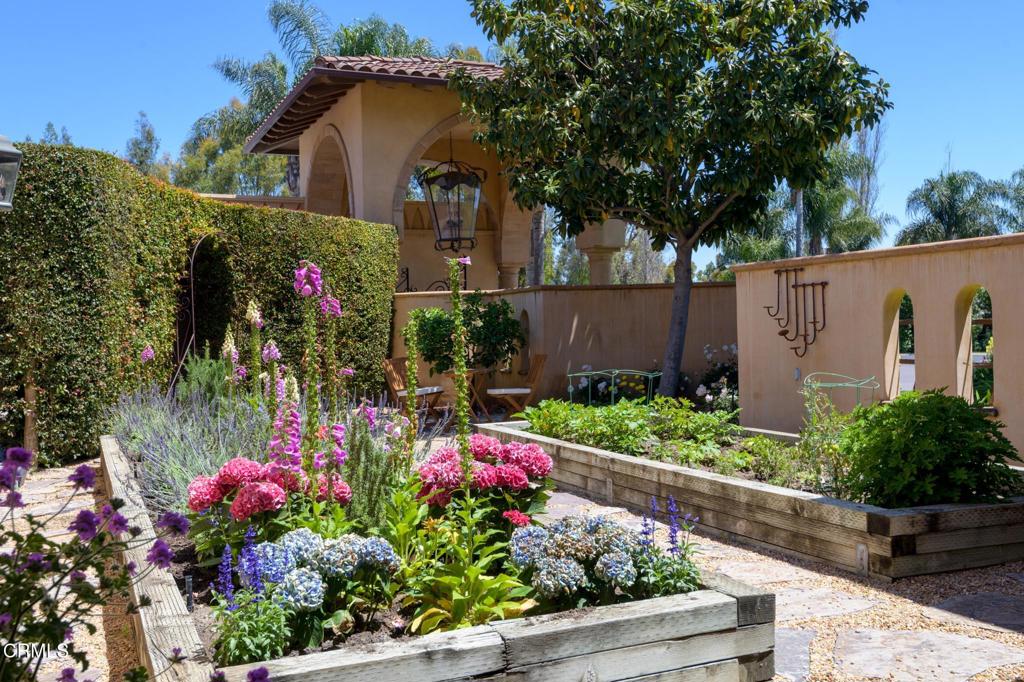 11113 Rocky High Road Camarillo, CA 93012 - Photo 14 of 48 a front view of a house with a yard and fountain