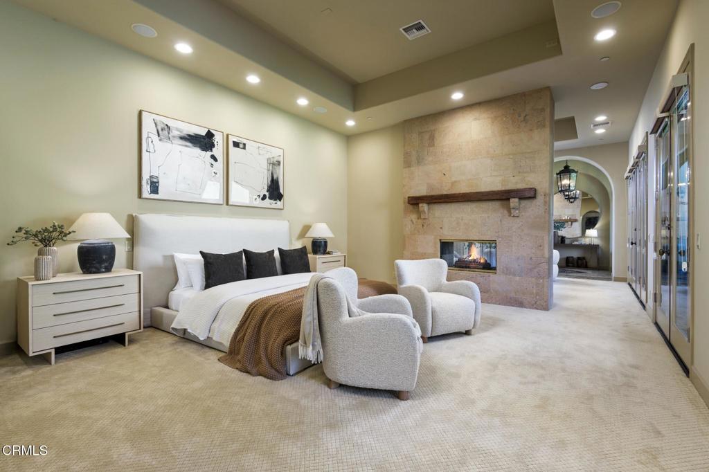 11113 Rocky High Road Camarillo, CA 93012 - Photo 23 of 48 a spacious bedroom with a bed and a couch