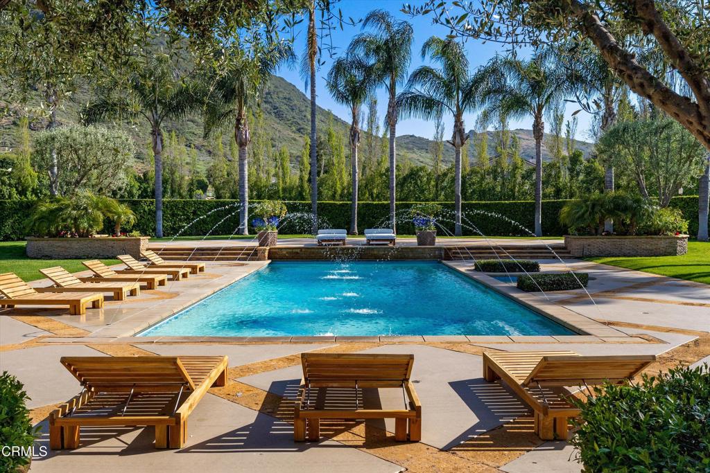 11113 Rocky High Road Camarillo, CA 93012 - Photo 29 of 48 a view of a swimming pool with lounge chairs in patio