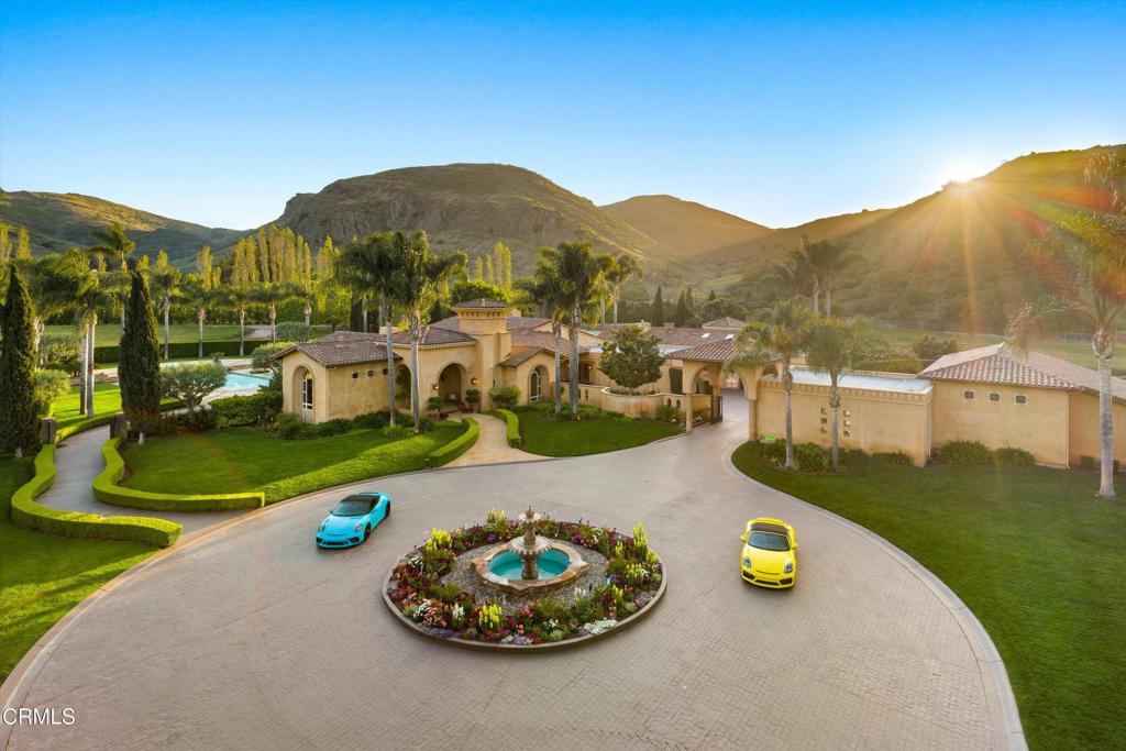 11113 Rocky High Road Camarillo, CA 93012 - Photo 32 of 48 a view of a swimming pool with a table and chairs