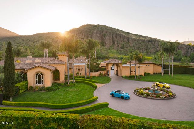a view of a swimming pool with a table and chairs