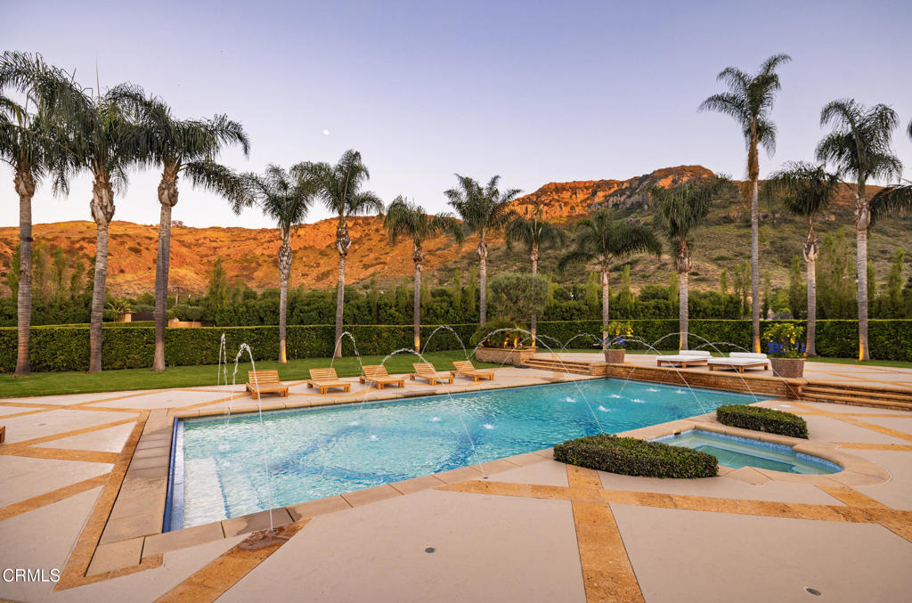 11113 Rocky High Road Camarillo, CA 93012 - Photo 41 of 48 a view of a house with a backyard and a patio