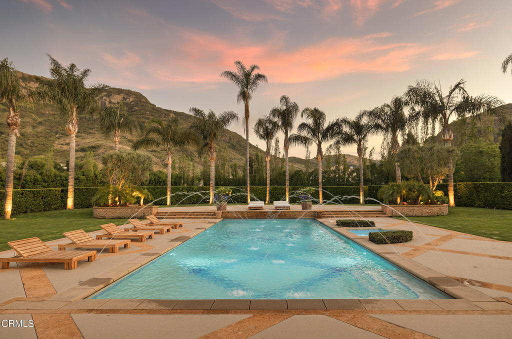 11113 Rocky High Road Camarillo, CA 93012 - Photo 44 of 48 a view of a swimming pool with an outdoor space and seating area