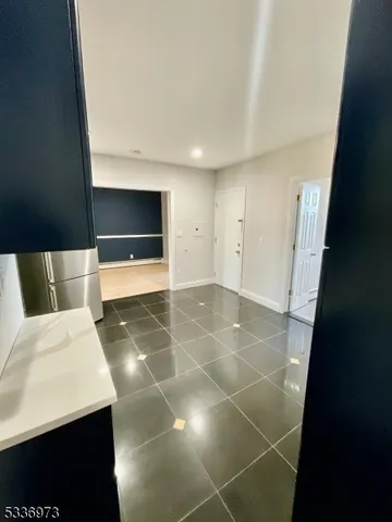 a view of an empty room with a fireplace