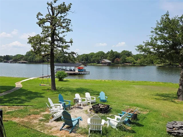 a view of a lake with a garden and houses