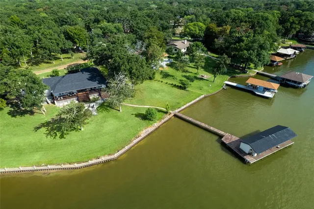 an aerial view of a house with a swimming pool