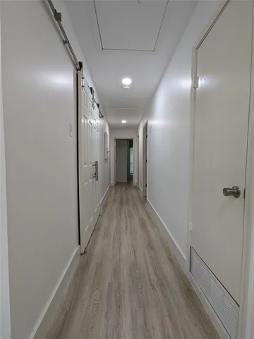 a large kitchen with stainless steel appliances granite countertop a stove top oven a sink dishwasher and a microwave oven on the blue kitchen countertops