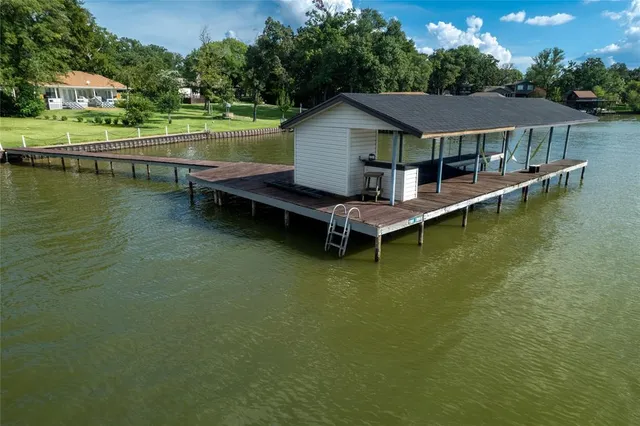 a small pool with lawn chairs
