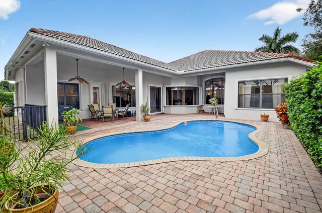 a view of a livingroom with furniture wooden floor and a chandelier