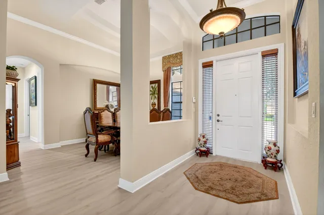 a large kitchen with stainless steel appliances granite countertop a refrigerator a sink a stove and oven