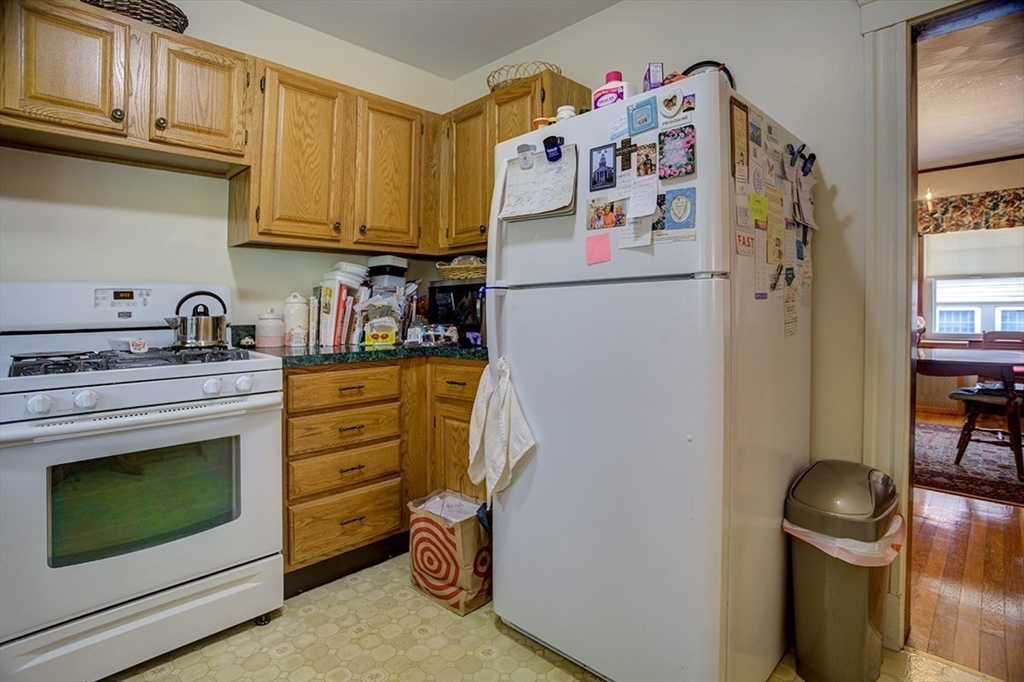 44 Cottage Park Road Winthrop, MA 02152 - Photo 35 of 39 a kitchen with a refrigerator and a stove