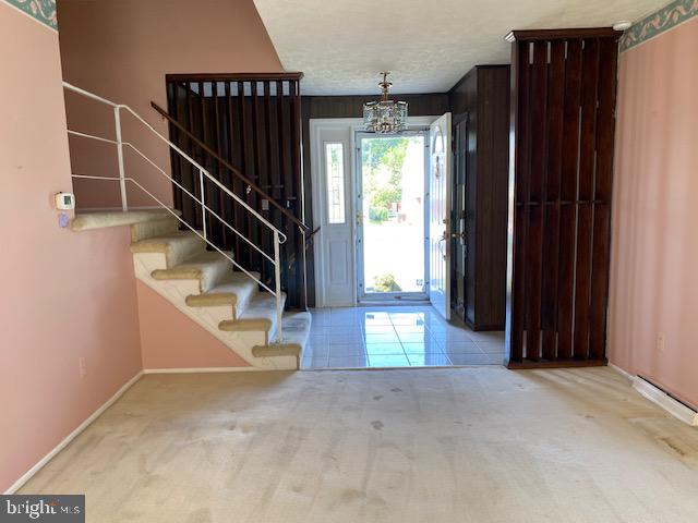 123 Othoridge Road Lutherville-Timonium, MD 21093 - Photo 18 of 32 Entry and stairs to upper level