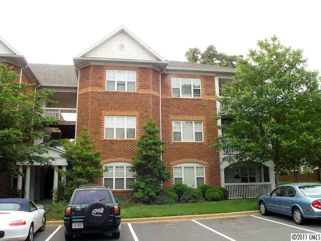 5617 Fairview Road, Unit 12 Charlotte, NC 28209 - Photo 2 of 14 a car parked in front of a house
