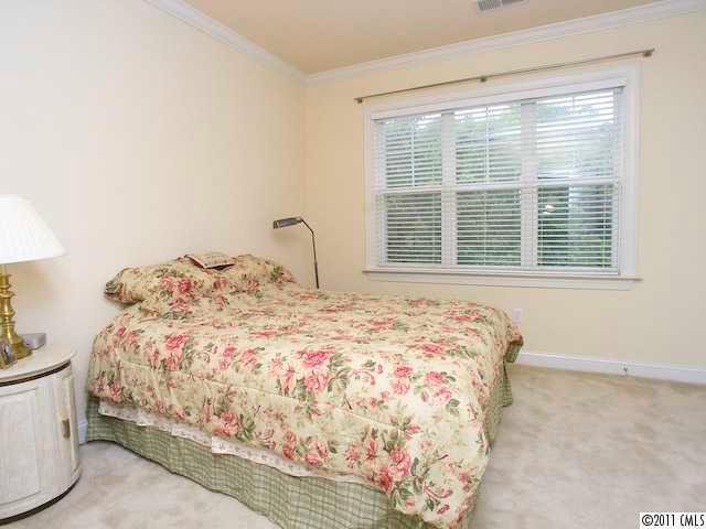5617 Fairview Road, Unit 12 Charlotte, NC 28209 - Photo 12 of 14 a bedroom with a bed and a window