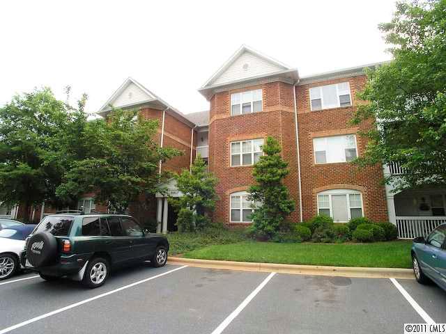 5617 Fairview Road, Unit 12 Charlotte, NC 28209 - Photo 14 of 14 a view of a car parked in front of a house