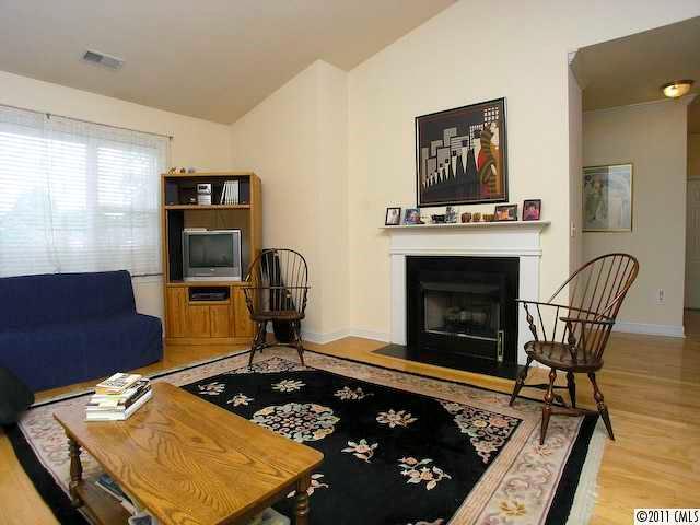 5617 Fairview Road, Unit 12 Charlotte, NC 28209 - Photo 3 of 14 a living room with furniture and a fireplace