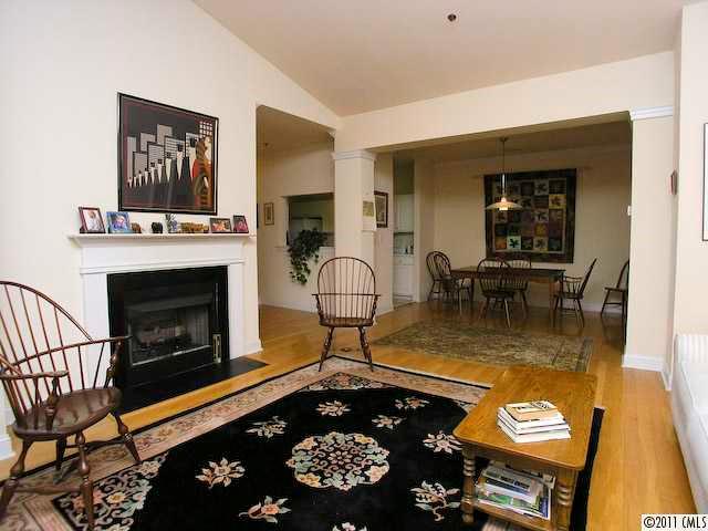 5617 Fairview Road, Unit 12 Charlotte, NC 28209 - Photo 4 of 14 a living room with a fireplace and rug floor