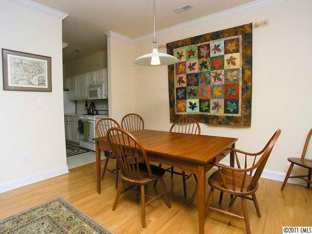 5617 Fairview Road, Unit 12 Charlotte, NC 28209 - Photo 5 of 14 a view of a dining room and hall with furniture