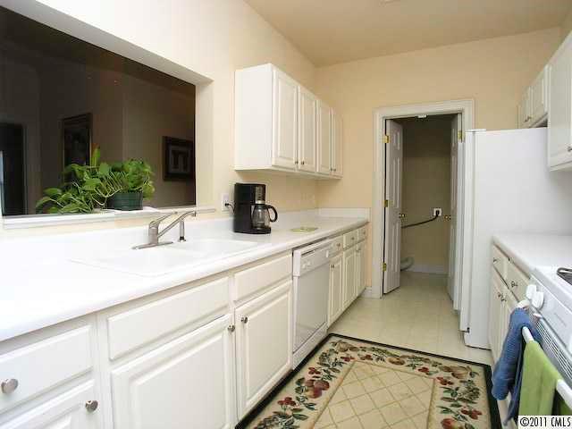5617 Fairview Road, Unit 12 Charlotte, NC 28209 - Photo 6 of 14 a bathroom with a sink a vanity and a mirror