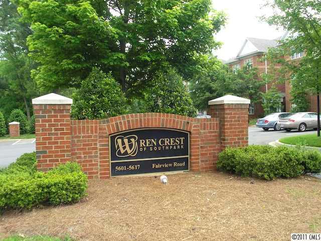 5617 Fairview Road, Unit 12 Charlotte, NC 28209 - Photo 8 of 14 a sign board with buildings in the background