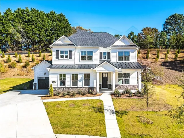 a view of living room with baby crib and furniture