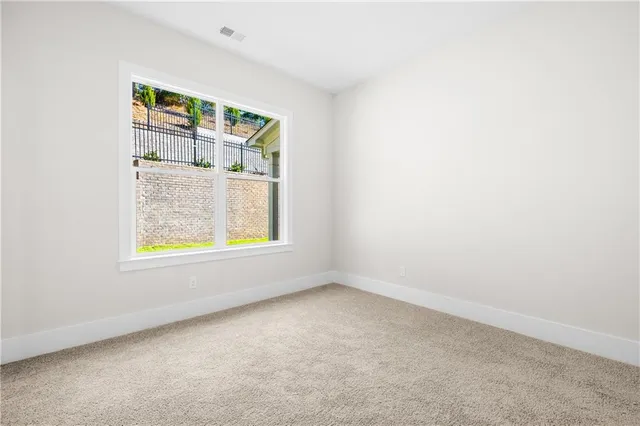 a bathroom with double vanity sinks and a large mirror