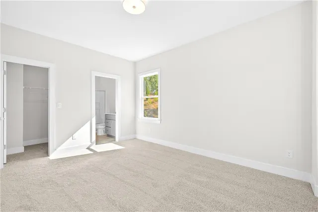 a bathroom with a bathtub sink and mirror