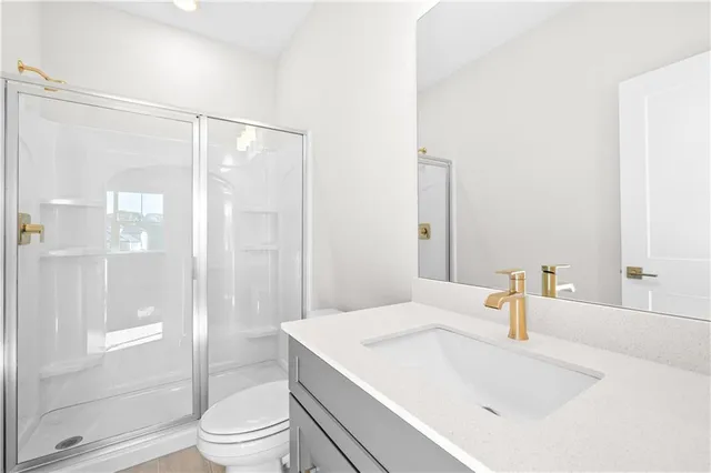 a bathroom with a sink a mirror and a shower