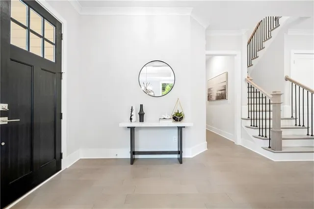 a living room with furniture and kitchen view