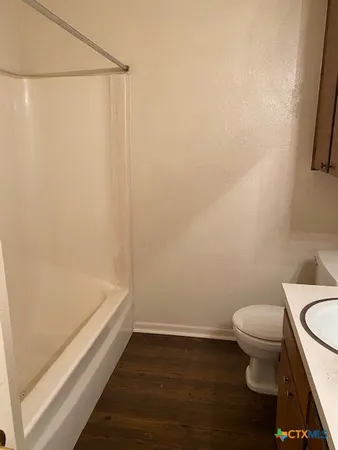 a bathroom with a sink and a toilet