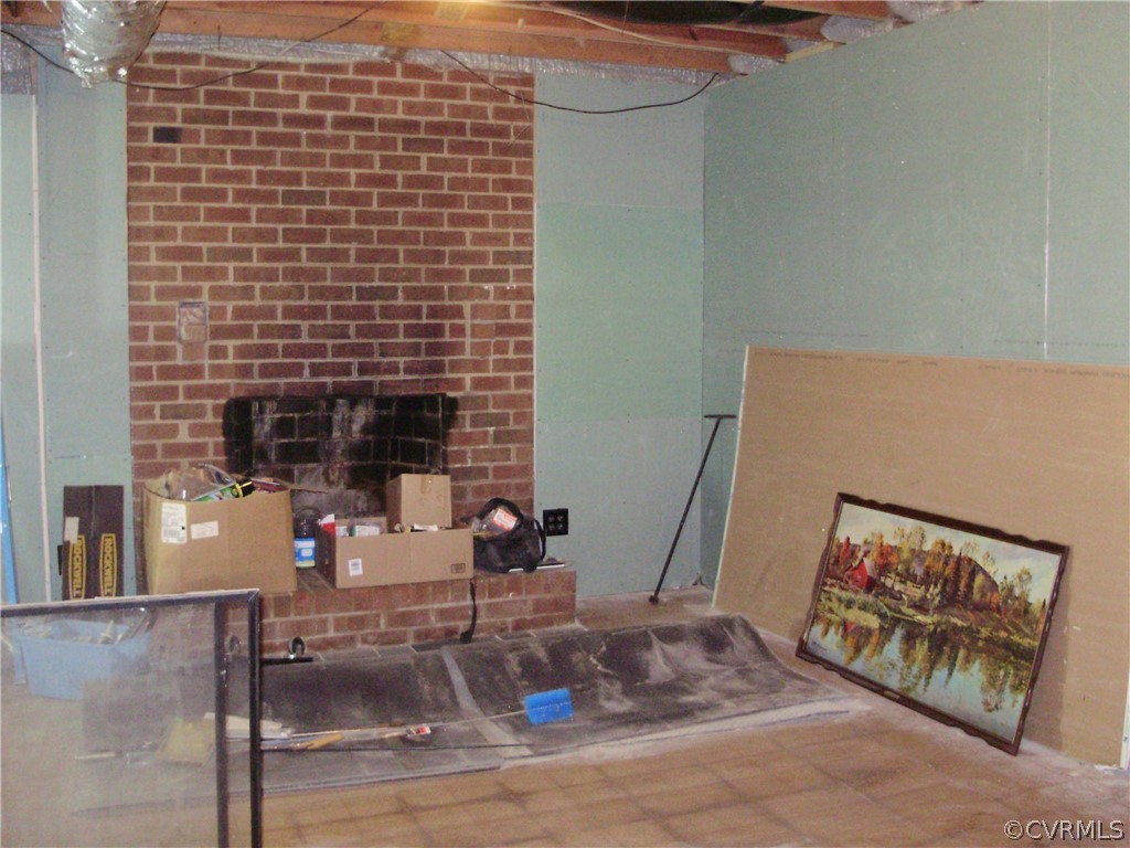 3720 Cottrell Road Richmond, VA 23234 - Photo 32 of 49 Unfinished family room with wood burning fireplace