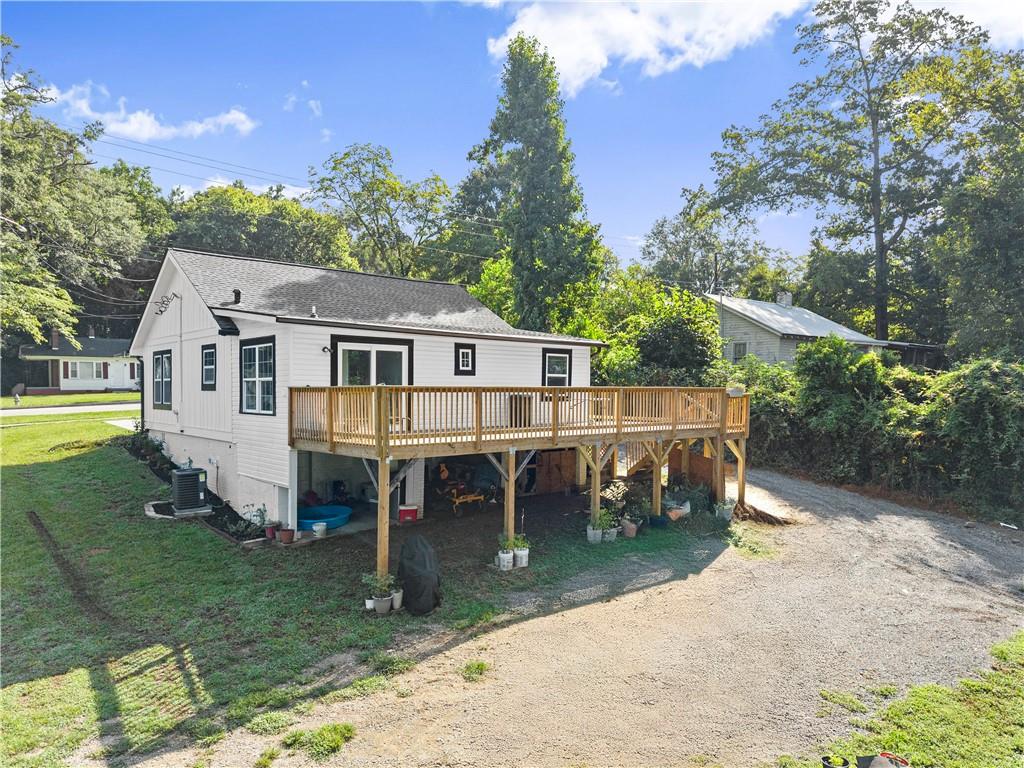 5626 Austell Powder Springs Road Southwest Austell, GA 30106 - Photo 12 of 36 a view of a house with backyard porch and sitting area